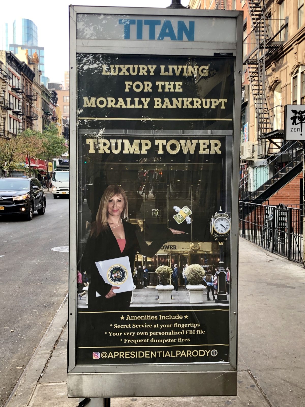A phone booth with a poster mocking realtor agencies of Trump Towers and the 2016 presidential elections.