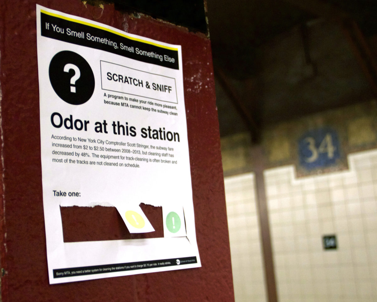 A flyer that resembles a NYC MTA announcement on a red column in the 34th street train station.
