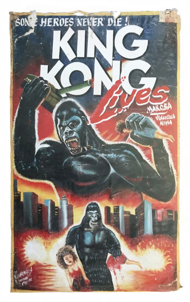 A movie poster of a gorilla holding a tank and a woman as it towers over another gorilla and a city.