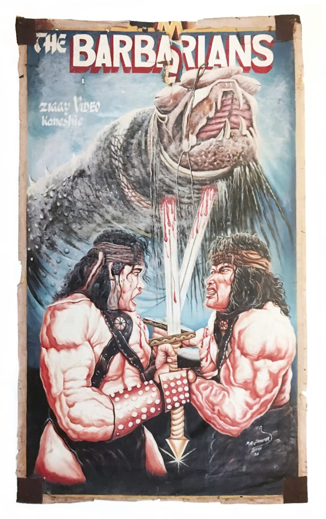 A movie poster of 2 shirtless and bloody males fighting with large swords with a monster behind.
