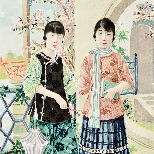 two young women heavily accessorized holding school books