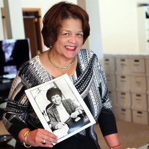 photograph of author Cheryl D Miller holding a photograph