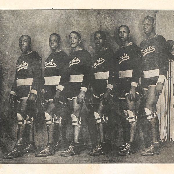 Black basketball players in black and white.