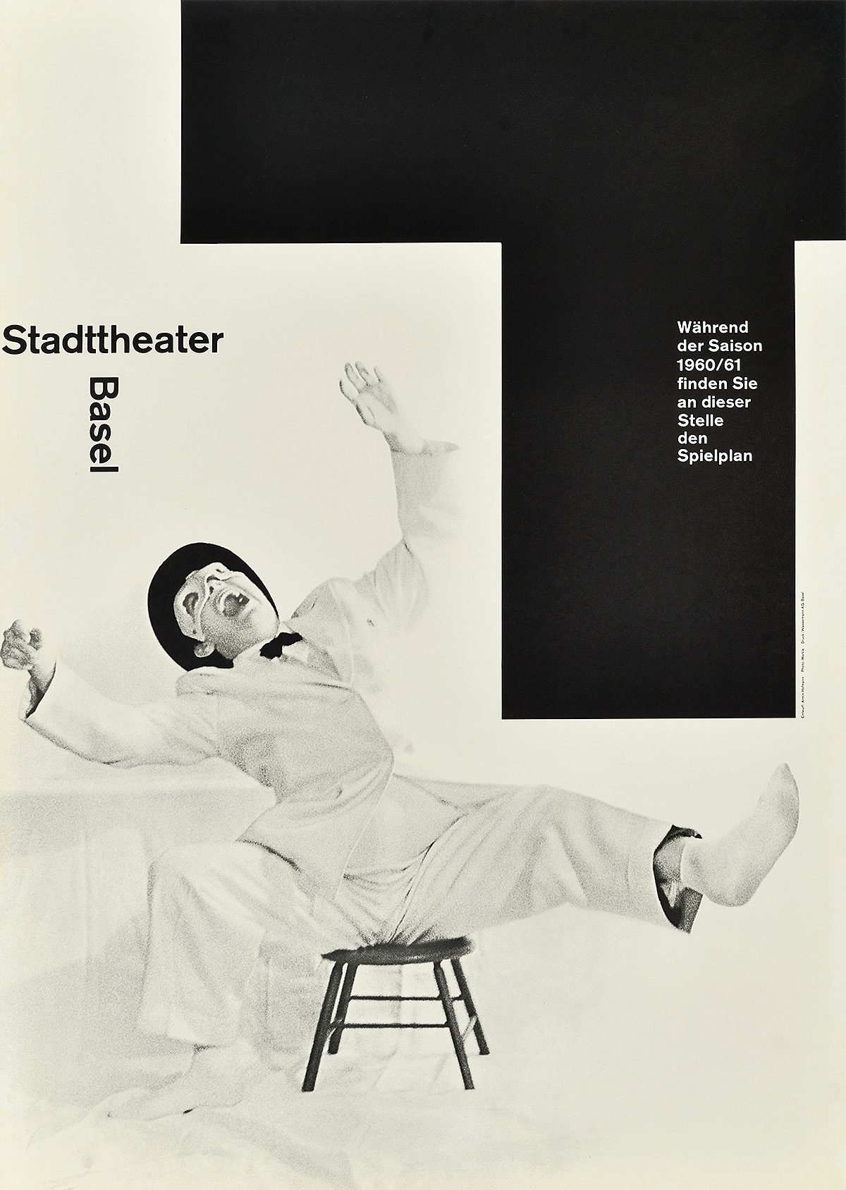 photographic poster of a man in a white suit laughing in a chair