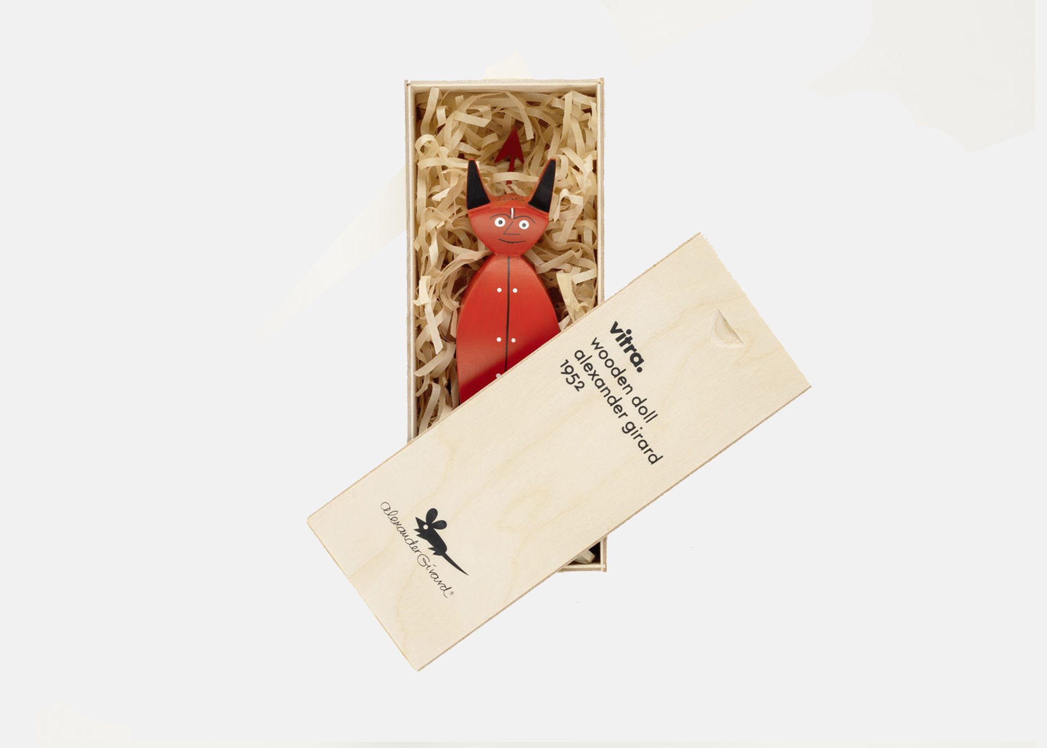 A photo featuring a red devil figurine inside a wooden casket on a gray background.