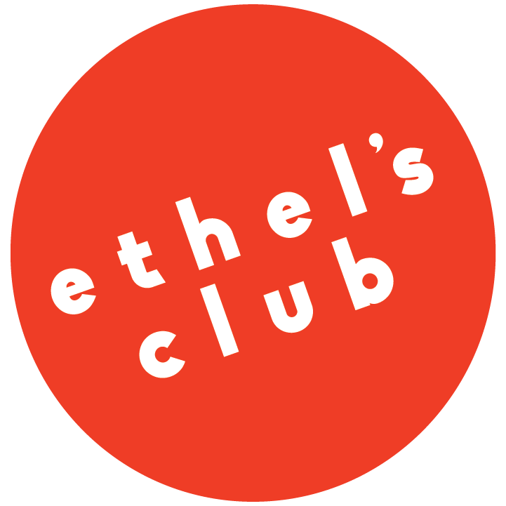 Red Circle with Ethel's Club in white text at an angle.