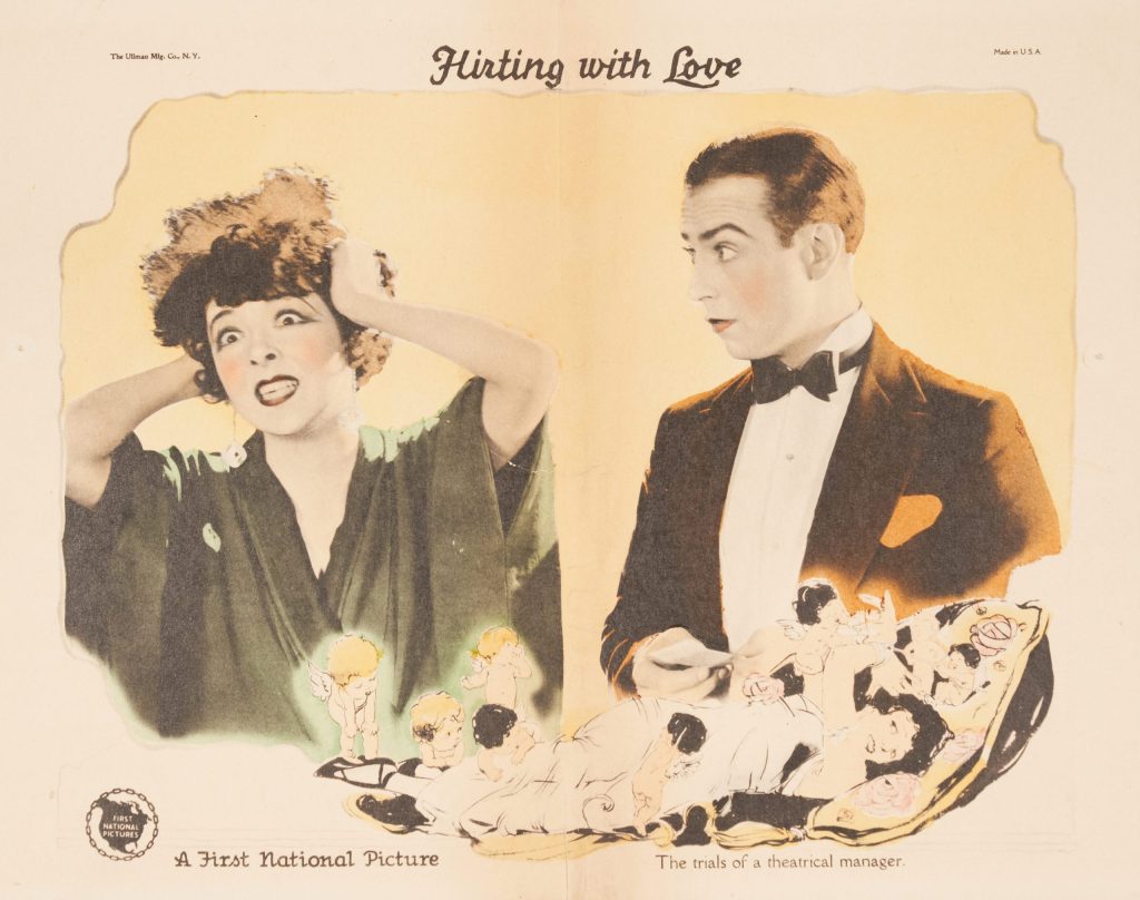 A photographic lobby card of a man and woman looking exasperated.