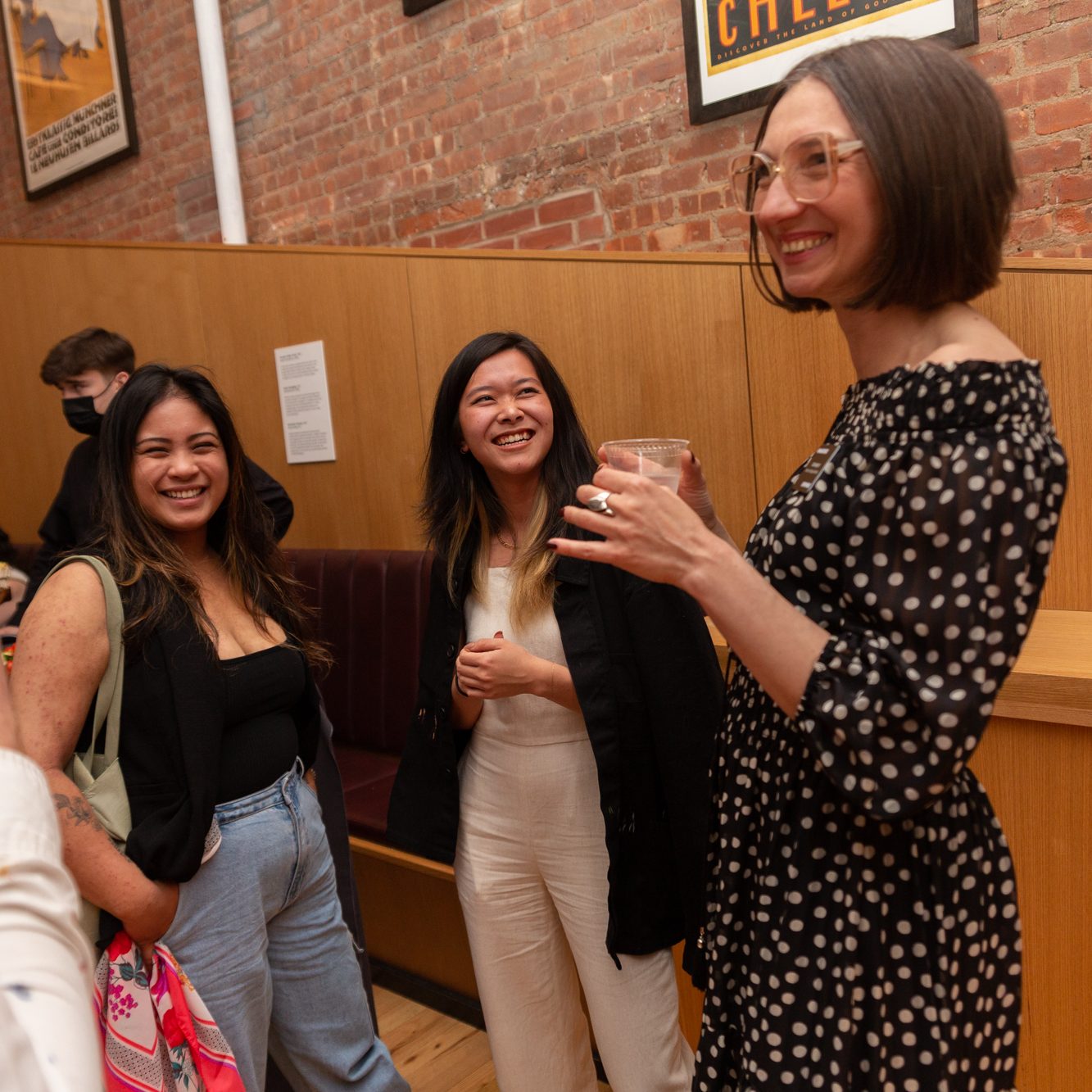 a photograph of people enjoying drinks in the cafe