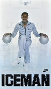 Poster of a man in a track suit holding two basketballs on an ice throne.