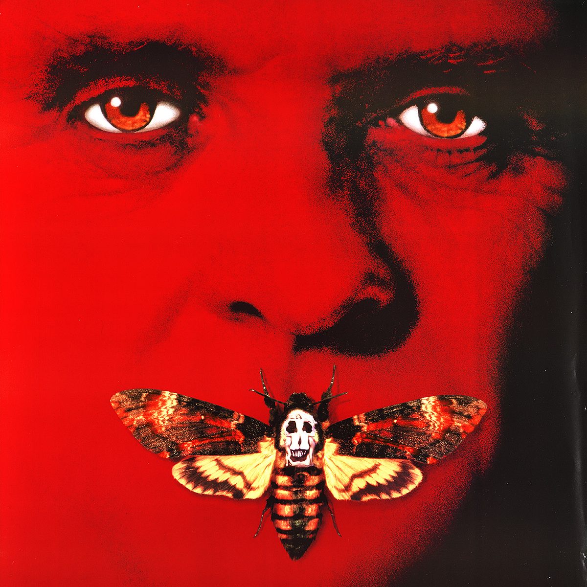 A picture of a man in red with a butterfly covering its mouth