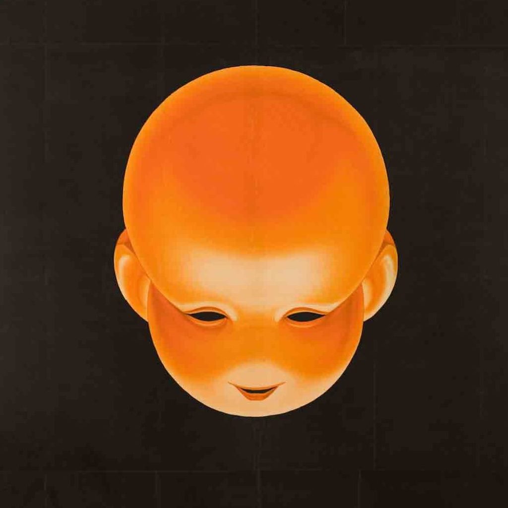 A poster image of baby head on a field of black with green ribbon lettering