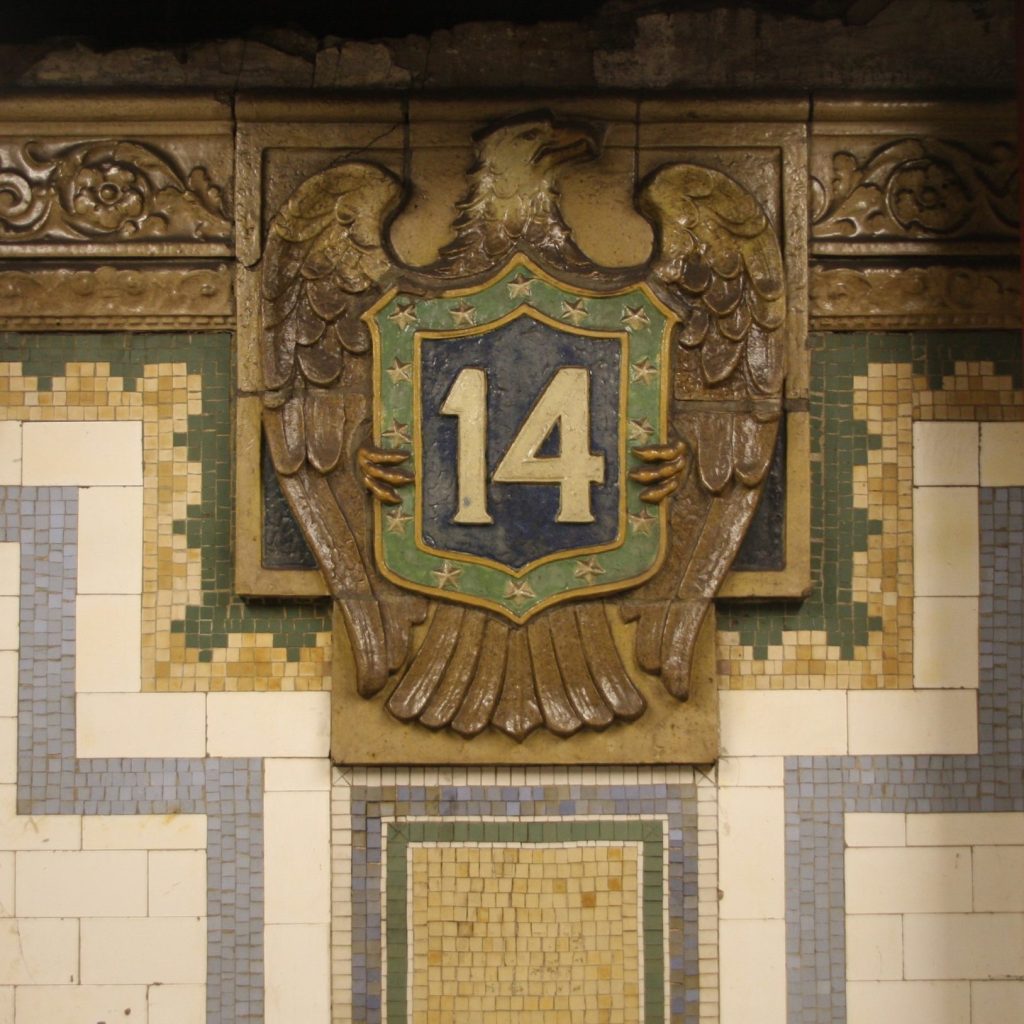 A photo of a ceramic reflief in the 14th Street Subway Station