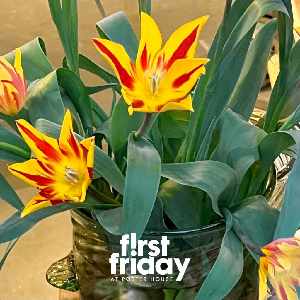 A photo image of several flowers in a vase