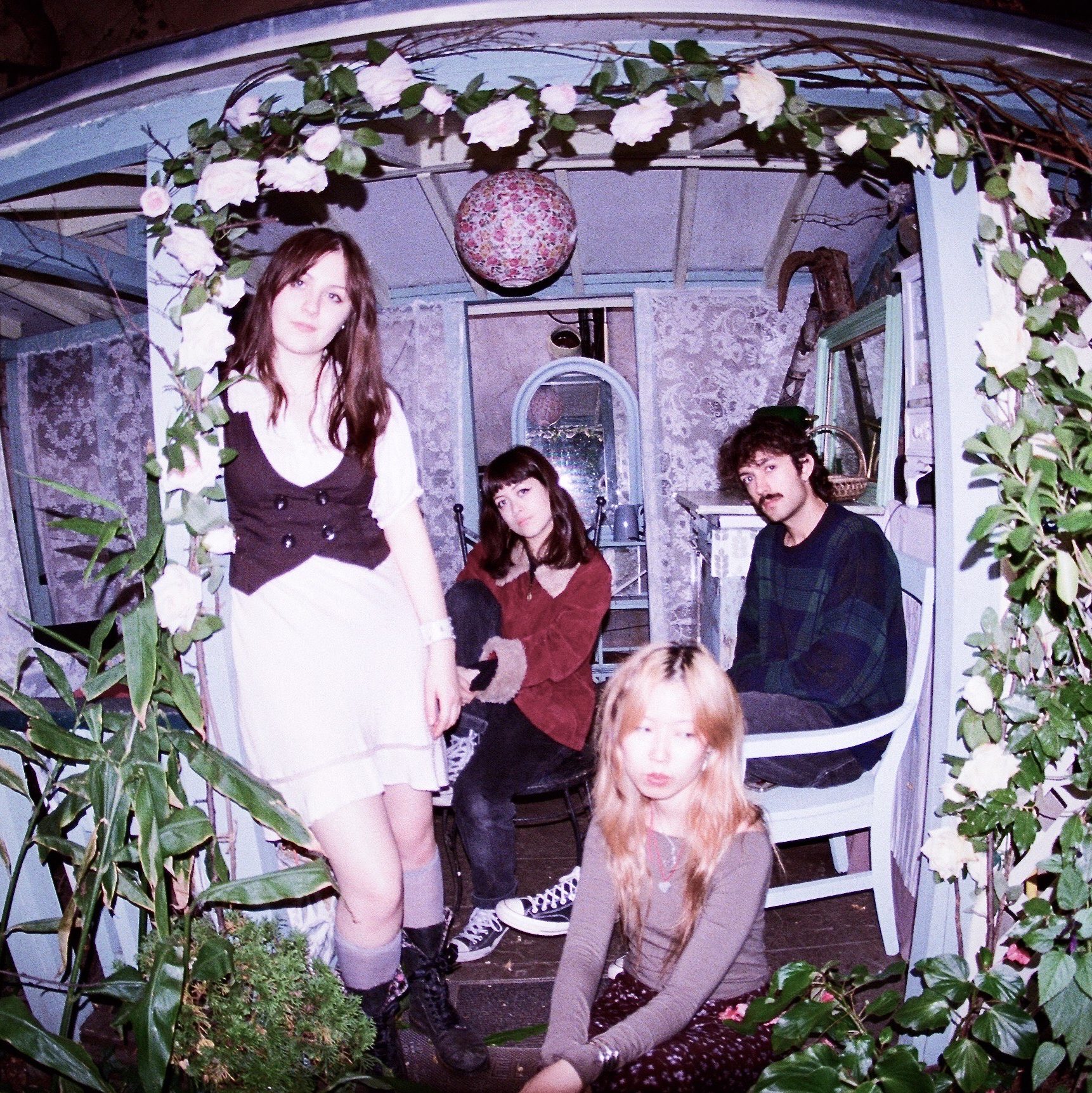 Band photo of Whisper Doll taken with a fish lens