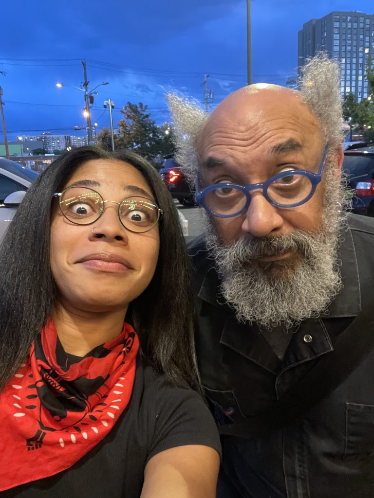Photo of a young black woman and a black man making funny faces.
