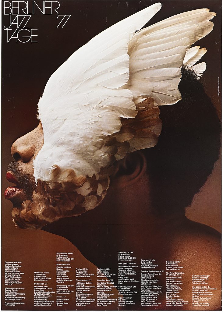 Poster of a man's face obscured by giant dove wings.