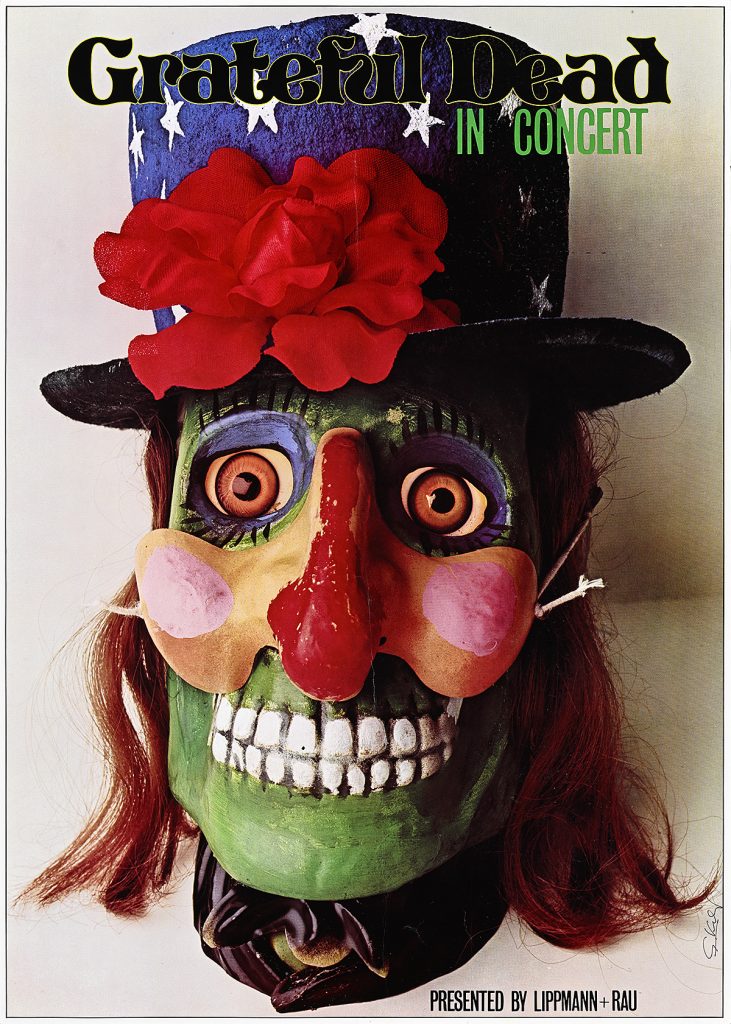 Poster of a green skeleton mask wearing a top hat with flowers.