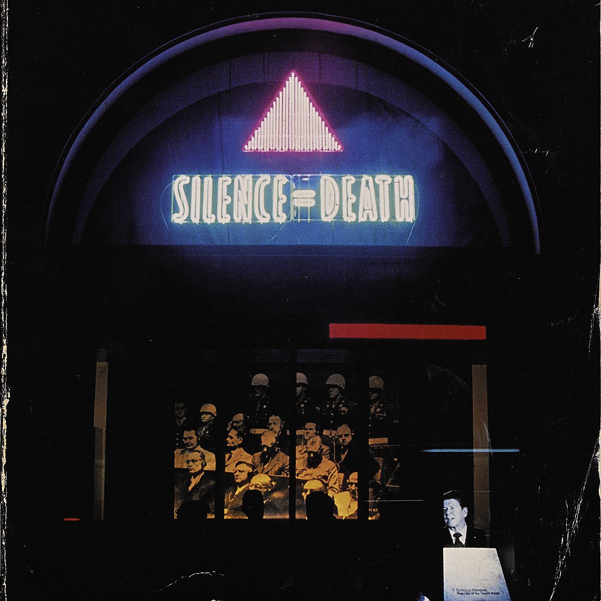 photograph of the Act Up logo as a neon sign on the facade of a building