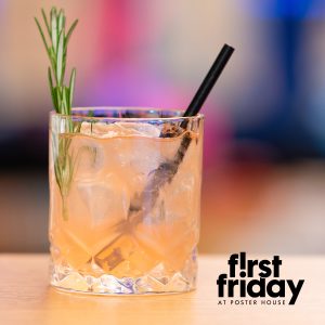 A peach colored cocktail in a rocks glass with a rosemary sprig and a black straw sticking out of it.